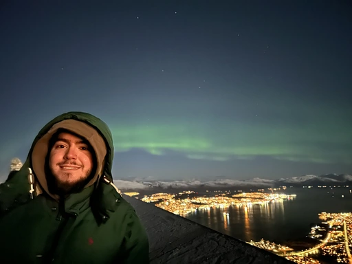 Portrait of Robert in Tromsø, Norway with a beautiful Aurora Borealis in the background